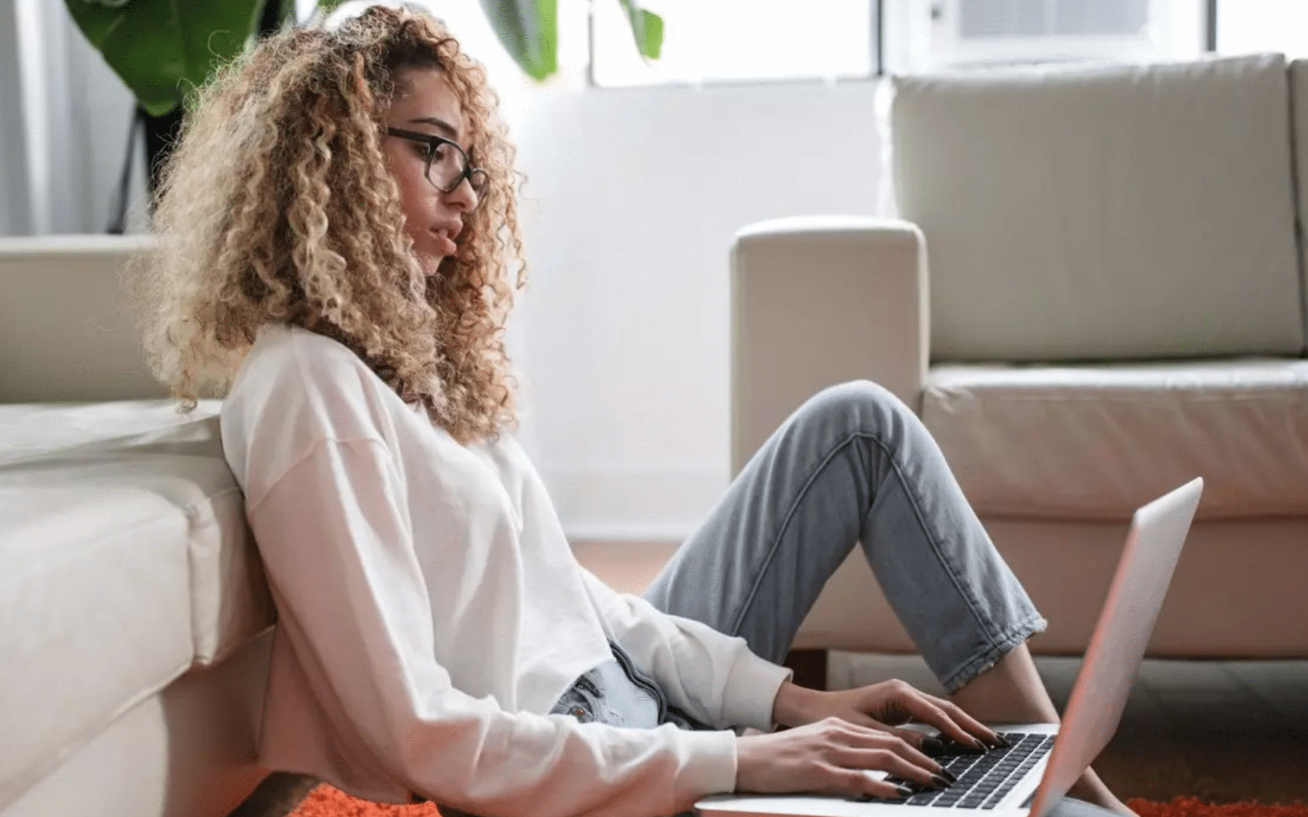 Woman working comfortably from home on her laptop