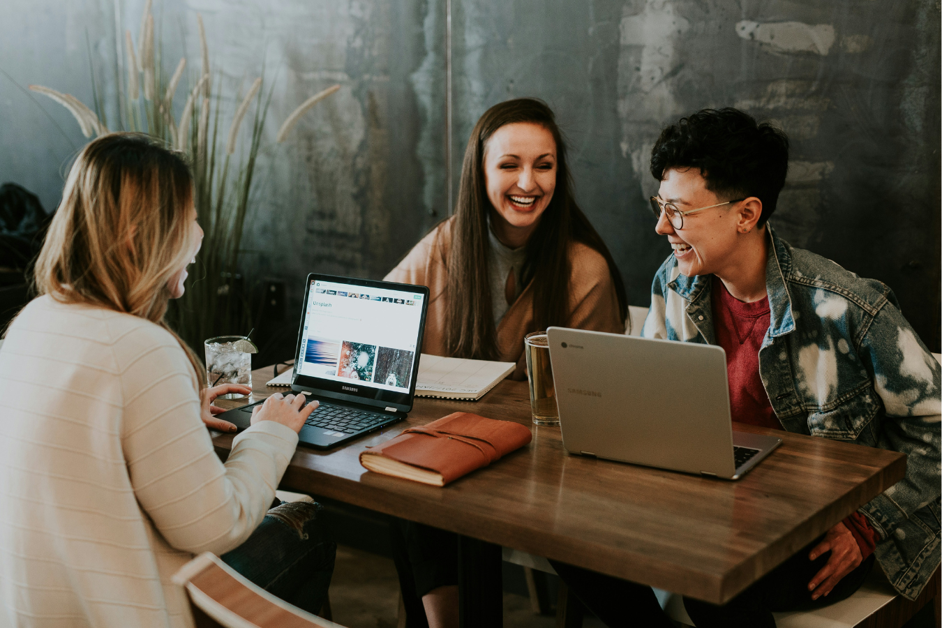 Group of three people working together at a table